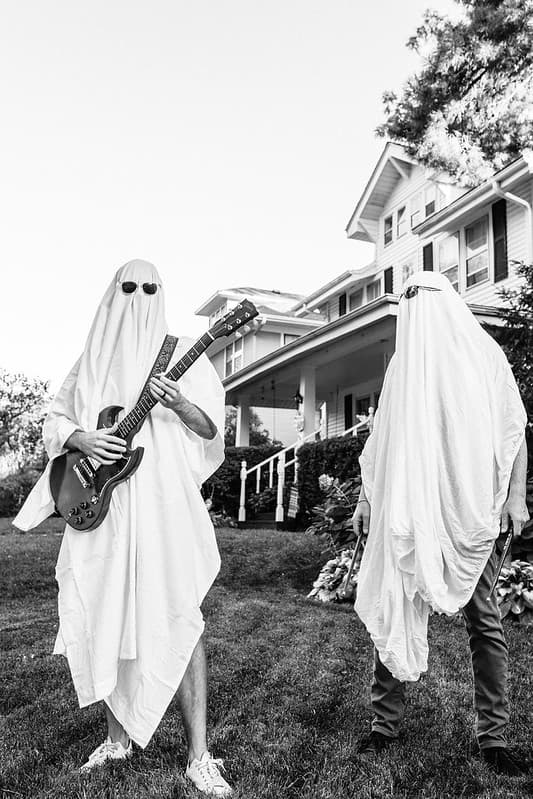 Vocalist framed by dramatic side lighting