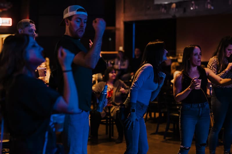 Guitarist and bassist trading licks on stage