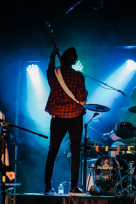 Singer reaching out to fans in the front row