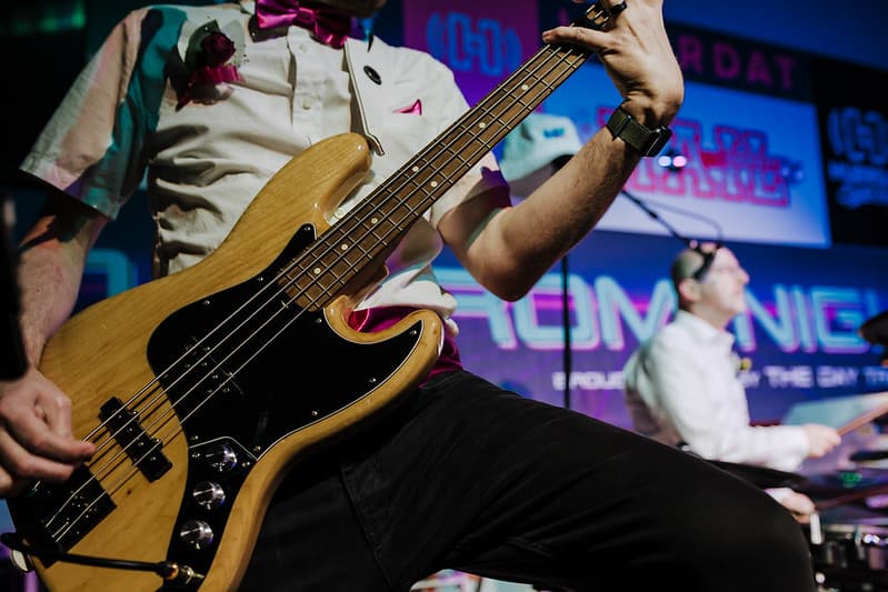 Band performing at sunset during an outdoor reception