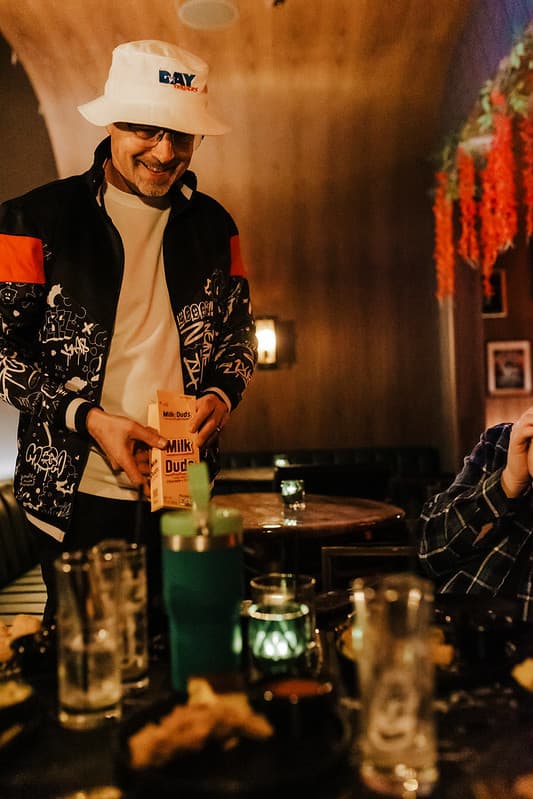 Guitarist silhouetted by blue and pink stage lights